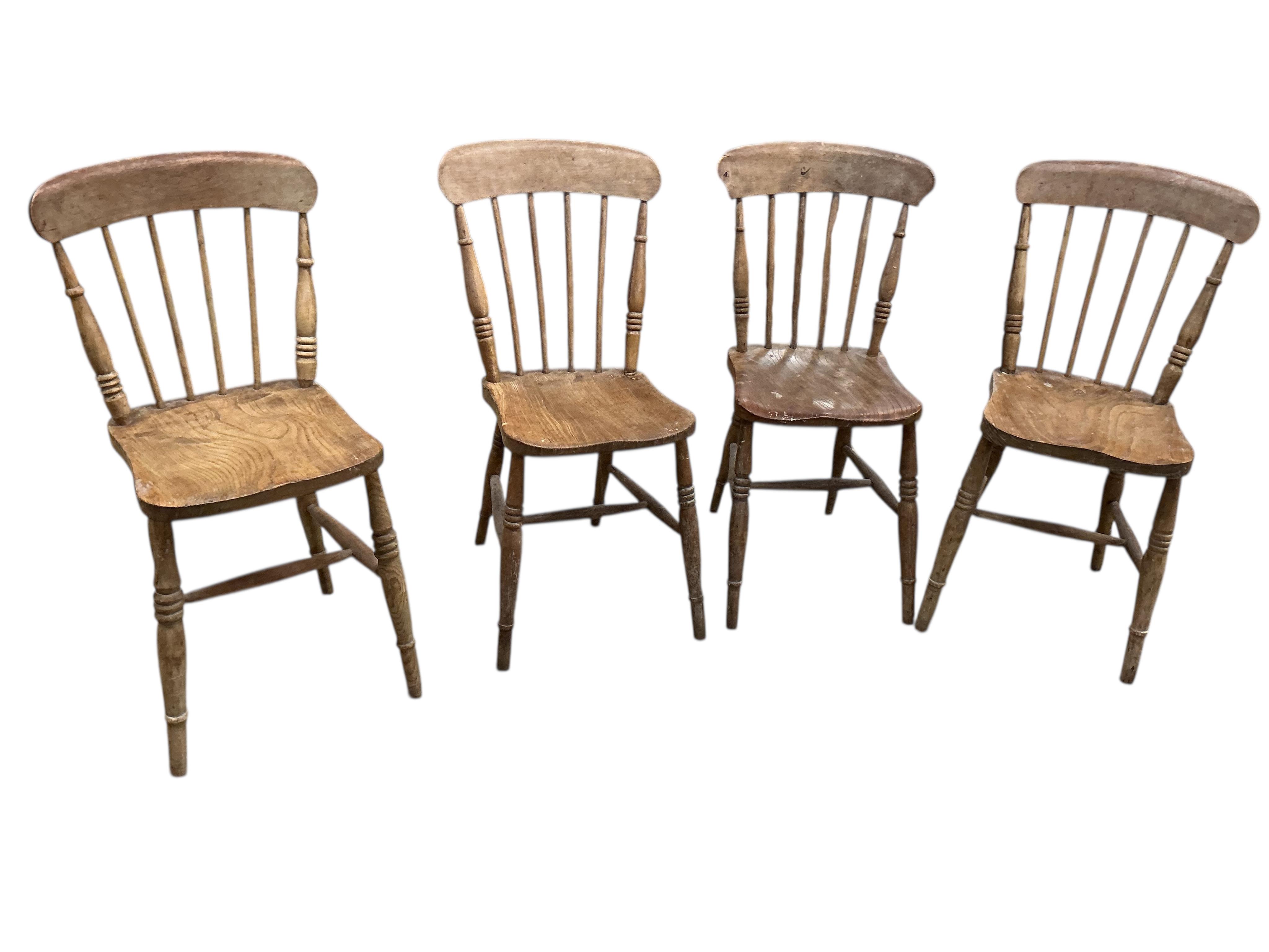 A Victorian rectangular pine kitchen table, width 133cm, depth 82cm, height 72cm together with four Victorian Windsor elm and beech comb back kitchen chairs
